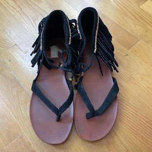 Black sandals with fringe detailing